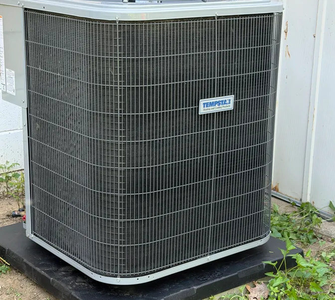 New Tempstar air conditioner installed on a fresh pad by BreezeTech Heating and Cooling