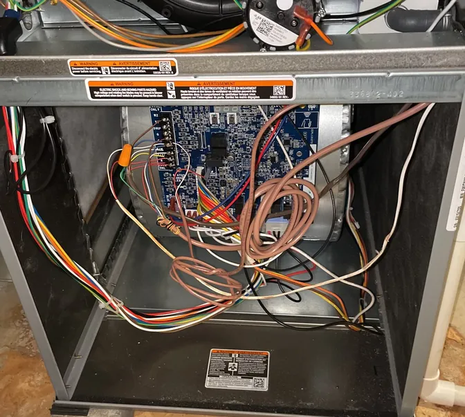 Furnace control board and wiring during a BreezeTech Heating and Cooling service call