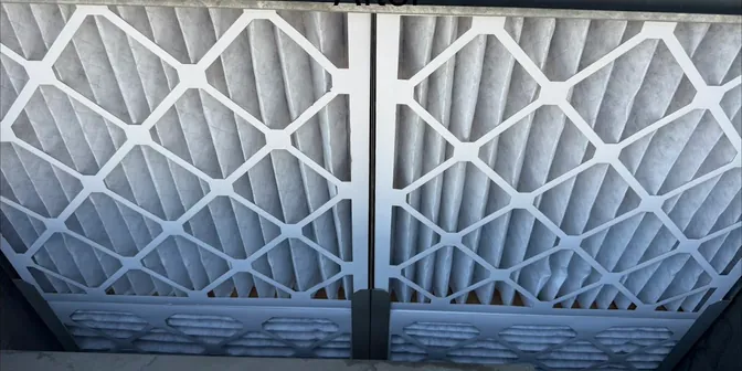 Fresh pleated air filters installed during a BreezeTech Heating and Cooling maintenance visit