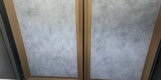 Clean air filters installed in a return air grille by BreezeTech Heating and Cooling