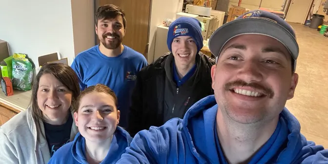 BreezeTech Heating and Cooling team selfie in the shop
