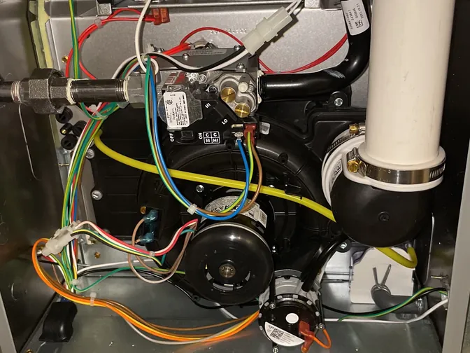 Inside a high-efficiency gas furnace: the inducer motor and gas valve
