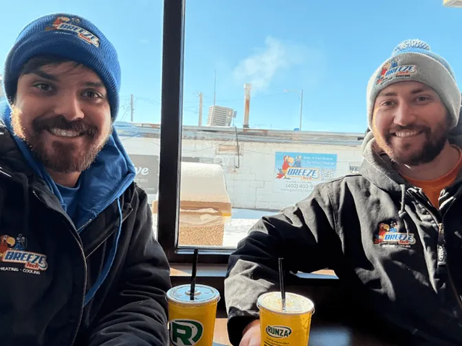 Two BreezeTech technicians grabbing lunch at Runza