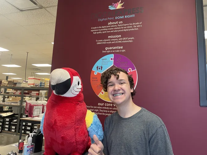 Silas with Max the Macaw at Digital Express Inc. in Omaha