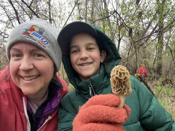 Holding up a morel mushroom found at Wilson Island