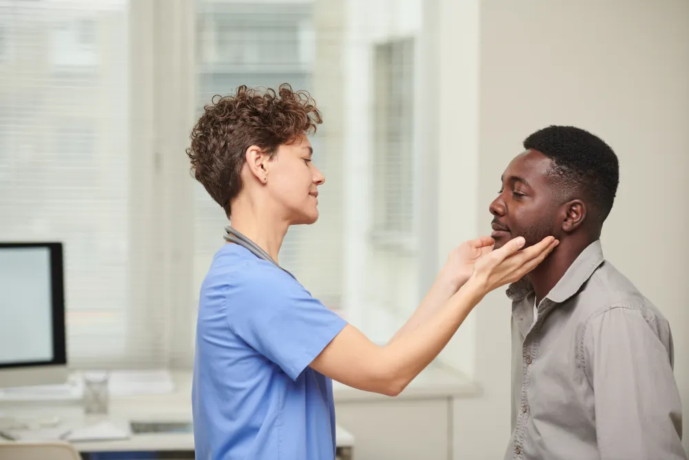 Doctor Examining patients throat.