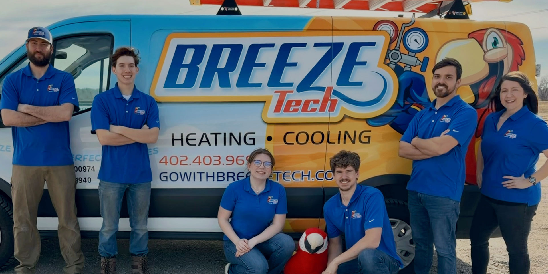 Breeze Tech team in front of a Breeze Tech van